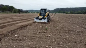 Farm field being cleared by our rock milling service.